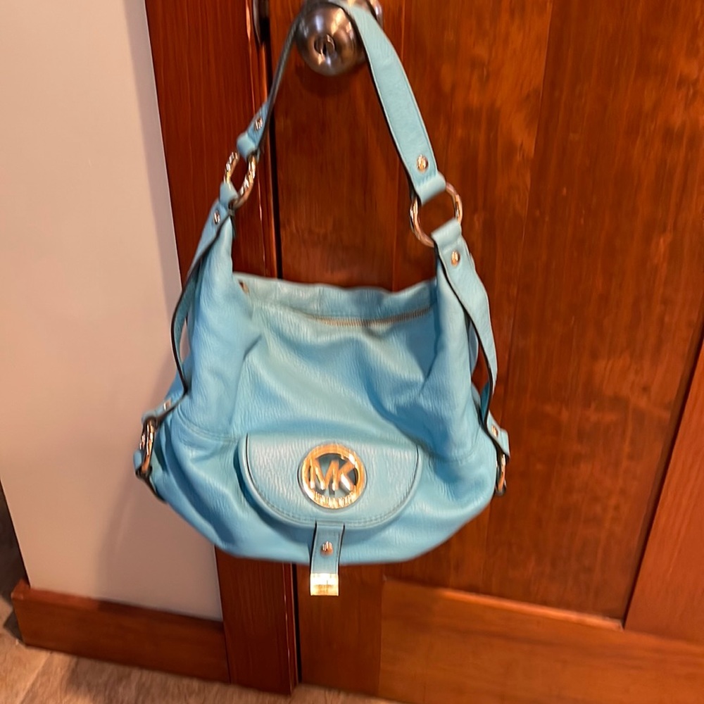 Beautiful Michael Korda Turquoise hobo bag.